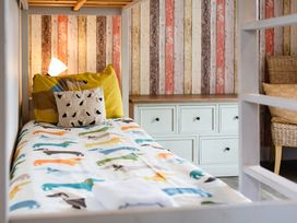 A bedroom with a bed and a drawer unit at Betony in Bamburgh