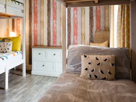A bedroom with a bunk bed and a drawer at Betony in Bamburgh