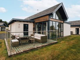 An outdoor area with seating and a coffee table at Betony in Bamburgh