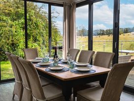 A dining room with a table set for meals at Betony in Bamburgh