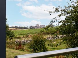 A view of a castle from a field at Betony in Bamburgh