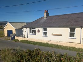 A house with a garage beside the road at Minydon in Fairbourne