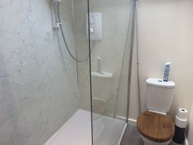 A bathroom with a shower and toilet at The Hideout in Llangrove