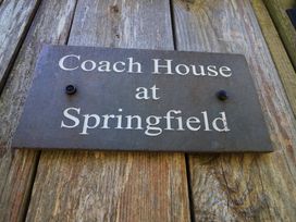 A sign for Coach House at Springfield