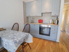 A kitchen with cabinets and an oven at 56C South Snowdon Wharf Porthmadog