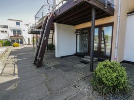 An outdoor area with stairs leading to a balcony at 56C South Snowdon Wharf Porthmadog