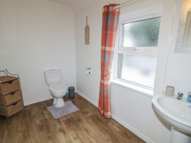 A bathroom with a toilet and sink at Shaws Hill Farmhouse, Kells, County Antrim