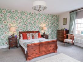 A bedroom with a bed and bedside tables at 20A St Hilda's in Whitby