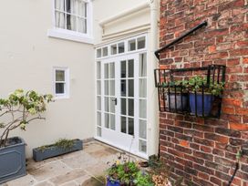An outdoor area with a door and plants at 20A St Hilda's in Whitby