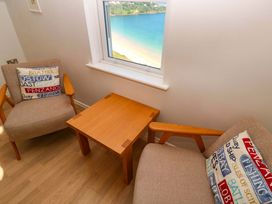 A snug with two chairs and a table at Meridian in Carbis Bay