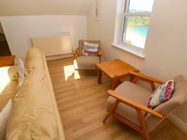 A living room with a sofa and chairs at Meridian in Carbis Bay
