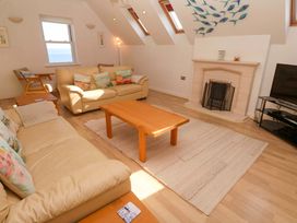 A living room with a coffee table and sofa at Meridian in Carbis Bay