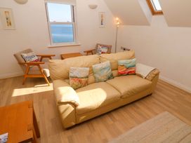A living room with a sofa and armchair at Meridian in Carbis Bay