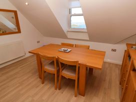 A dining room with a table and chairs at Meridian in Carbis Bay