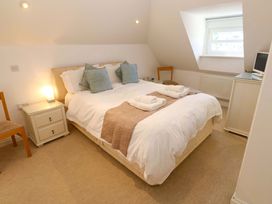 A bedroom with a bed and bedside table at Meridian in Carbis Bay