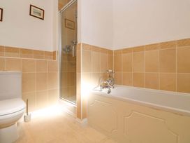 A bathroom with a shower, toilet, and bathtub at Meridian in Carbis Bay