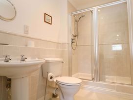 A bathroom with a sink, toilet, and shower at Meridian in Carbis Bay