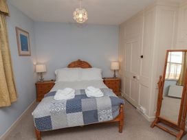 A bedroom with a bed and chest of drawers at Cobbles House, Whitby