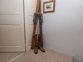 An entryway with boots and a framed picture at Cobbles House in Whitby