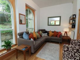 A living room with a sofa and coffee table at Damson Cottage in Whitby