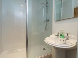 A bathroom with a shower and sink at Damson Cottage Whitby