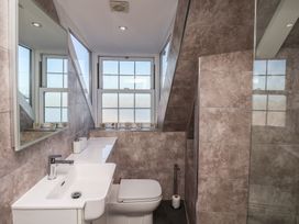 A bathroom with a sink and toilet at Beachfront in Whitby