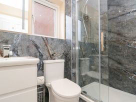 A bathroom with a shower and sink at Quayside Haven in Whitby