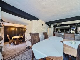 A dining room with tables and chairs at The Old Church House in Torbryan