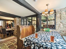 A dining room with a table and chairs at The Old Church House in Torbryan