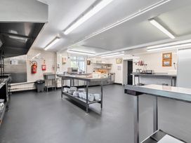 A kitchen with cooking equipment and utensils at The Old Church House in Torbryan