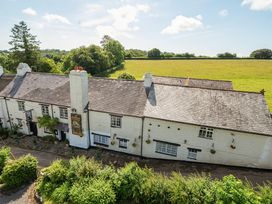 A house with a garden and fields at The Old Church House in Torbryan