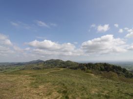 A view of hills under a cloudy sky at Hilltop House in Tenbury Wells