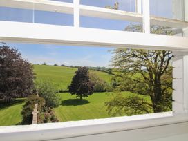 A view of green fields and trees from a window at Hilltop House in Tenbury Wells