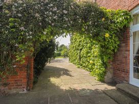 An archway covered with plants at Hilltop House in Tenbury Wells