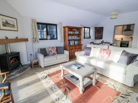 A living room with a sofa and coffee table at Keepers Cottage in West Knoyle