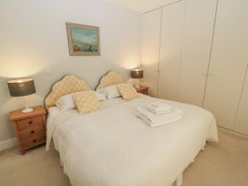 A bedroom with a double bed and nightstands at Keepers Cottage in West Knoyle