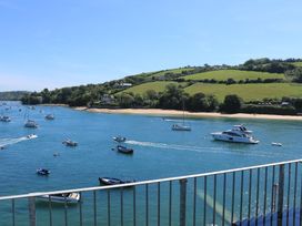 A view of boats on water with green hills and houses in the background at 37 The Salcombe in Salcombe