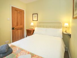 A bedroom with a bed and lamp at Sygun View in Beddgelert