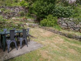 A table and chairs in a garden at Sygun View Beddgelert