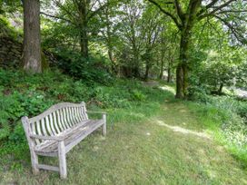 A bench in a wooded area at Sygun View in Beddgelert
