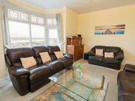 A living room featuring sofas and a coffee table at Preswylfa, Caernarfon