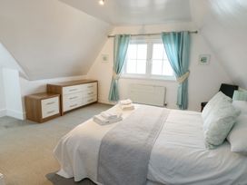 A bedroom with a bed and drawer unit at Preswylfa in Caernarfon