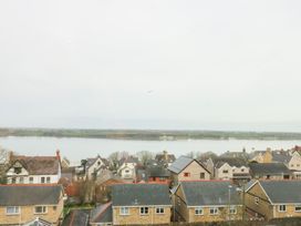 A view of houses by the water at Preswylfa in Caernarfon