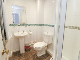 A bathroom with sink and shower at Preswylfa Caernarfon