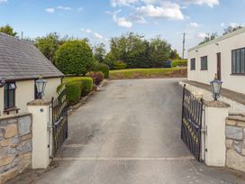 An entrance with gates and driveway at Arosfa Axton near Trelawynd