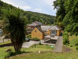 A house with decking and garden at Old Maids Cottage in Woolacombe