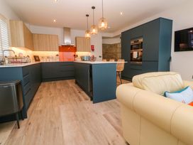 A kitchen with cabinets, island and appliances at 21 Alverton Street in Penzance