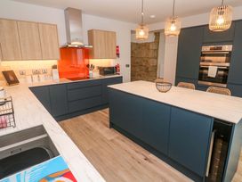 A kitchen with cabinets and appliances at 21 Alverton Street Penzance