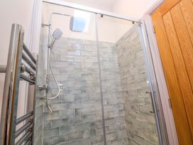 A shower with glass panel and tiled wall at 21 Alverton Street Penzance