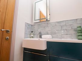 A bathroom with sink and mirror at 21 Alverton Street in Penzance